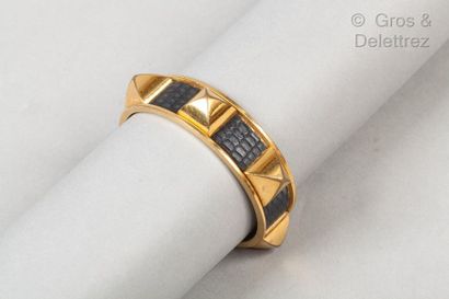 HERMES * Gold metal and black lizard bracelet with "Medor" nails.