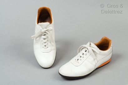 HERMES Paris made in Italy *Pair of laced up runners in white calf, rubber soles....