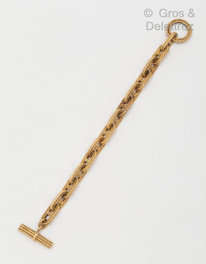 null 
Bracelet «Vendôme» en or jaune, composé de maillons chaîne d’ancre tressé....
