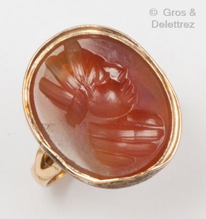 null Yellow gold ring with an intaglio on carnelian representing the profile of a...