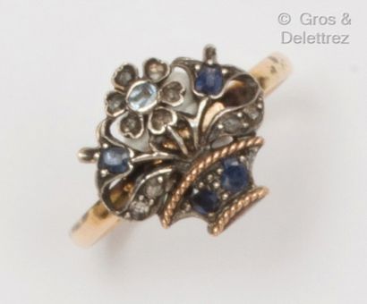 null Yellow gold and silver ring decorated with a floral basket, set with sapphires...