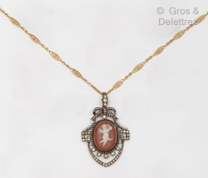 null Filigree gold chain holding a gilt pendant, adorned with an agate cameo depicting...