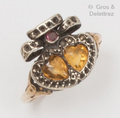 null Yellow gold and silver ring with a double heart motif, set with shaped citrines...