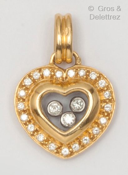null Pendentif «Cœur» en or jaune, orné de trois diamants mobiles entre deux plaques...