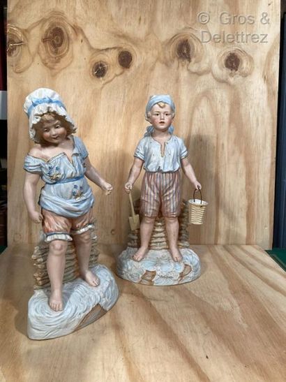 null Pair of barbotine sculptures depicting a little boy and a little girl in the...