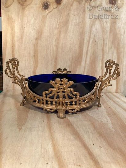 null Golden brass planter openworked with foliage scrolls and lovebirds. Blue glass...