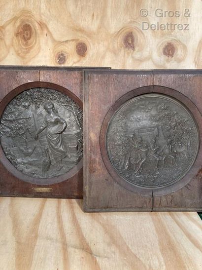 null Pair of round pewter plates decorated with a peasant woman feeding her lower...