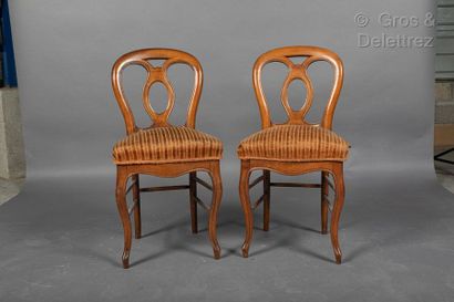 null Pair of moulded wooden chairs with openwork decoration. Striped velvet upho...
