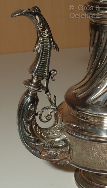 null Silver baluster coffee pot on a pedestal, the right body decorated with foliage...