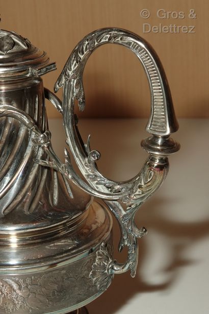 null Silver baluster coffee pot on a pedestal, the right body decorated with foliage...