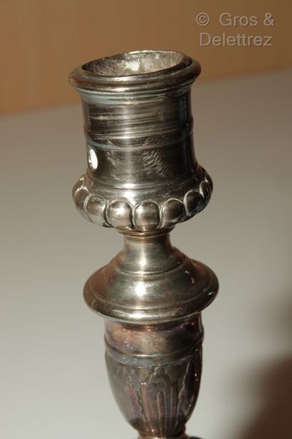 null Pair of toilet candlesticks in re-silvered metal, the shaft in baluster with...