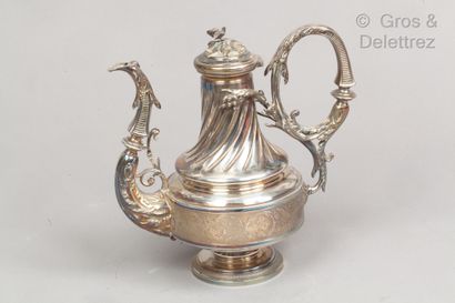 null Silver baluster coffee pot on a pedestal, the right body decorated with foliage...