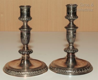 null Pair of toilet candlesticks in re-silvered metal, the shaft in baluster with...