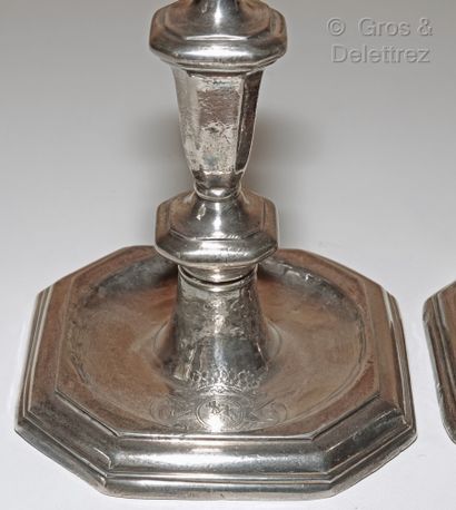 null A pair of silver toilet candlesticks, the shaft in baluster, the square base...