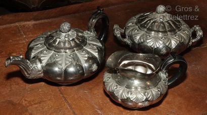 null 
Silver tea service composed of a teapot, a milk jug and a sugar bowl with rich...