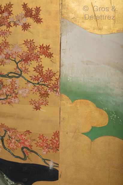 JAPON A large six-leaf folding screen depicting cranes in front of a mountainous...