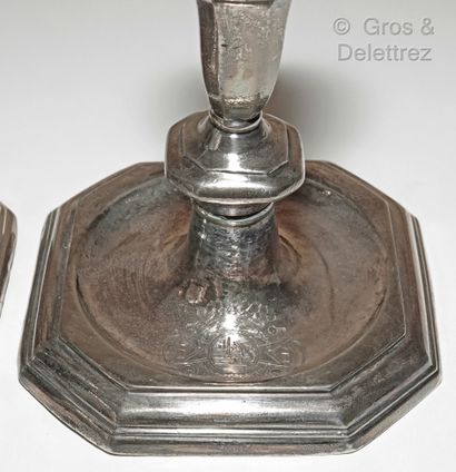 null A pair of silver toilet candlesticks, the shaft in baluster, the square base...