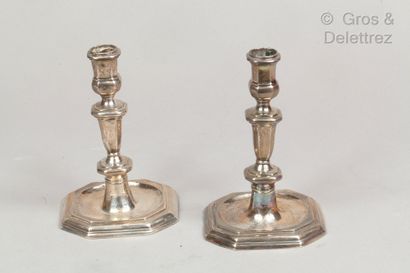 null A pair of silver toilet candlesticks, the shaft in baluster, the square base...