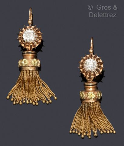 null A pair of yellow gold earrings, each with an old cut diamond supporting a pompom...