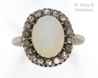 Yellow gold and silver ring, set with a cabochon...