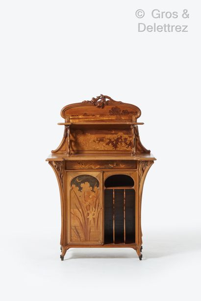 Émile GALLÉ (1846-1904) Rare walnut music cabinet with a moulded top and arched cut-out...