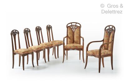 Louis MAJORELLE (1859-1926) Set of two armchairs and four chairs in walnut with a...
