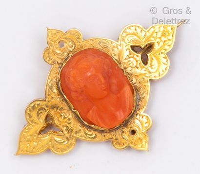 A yellow gold openwork brooch with a cameo...