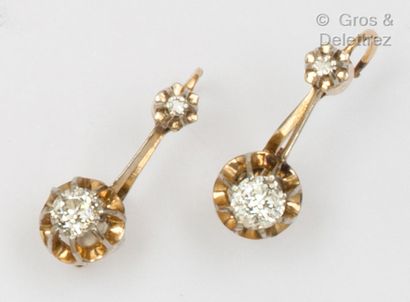 null Pair of yellow gold "Dormeuse" earrings, each set with an old cut diamond. Gross...