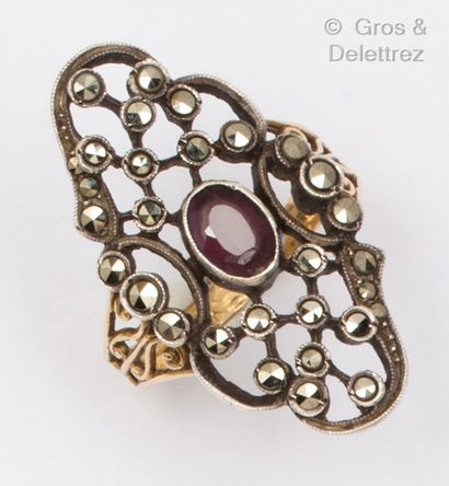 A gold and silver ring with an oval amethyst...