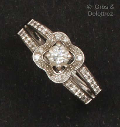 MAUBOUSSIN White gold ring, set with a brilliant-cut diamond in a circle of smaller...