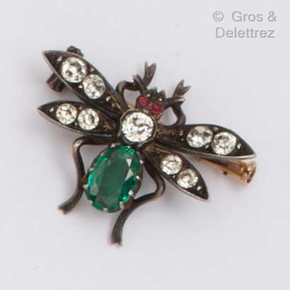 null Silver "Mouche" brooch, decorated with rhinestones and an oval emerald, the...