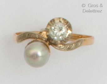  Yellow gold "Toi et Moi" ring, set with a button pearl and a brilliant-cut diamond....