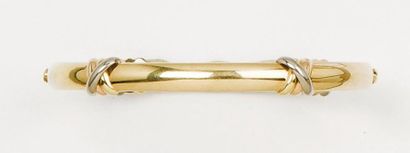 CARTIER Bracelet jonc en or jaune orné de motifs «Trinity» en or de trois couleurs....