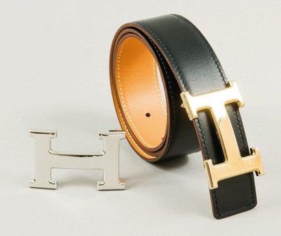 HERMES Paris made in France Ceinture réversible en cuir noir et gold à surpiqures...