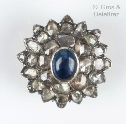 null Silver and yellow gold "Rosace" brooch, set with a cabochon sapphire in a setting...