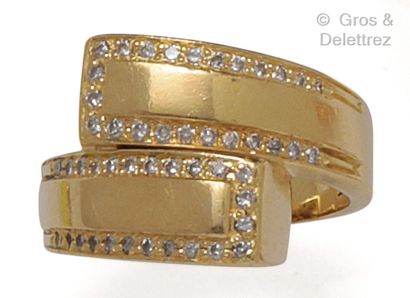 null Yellow gold "Crossed" ring, set with lines of brilliant-cut diamonds. Finger...