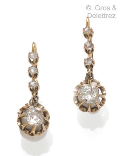 null A pair of yellow gold earrings, each set with old-cut diamonds topped with rose-cut...