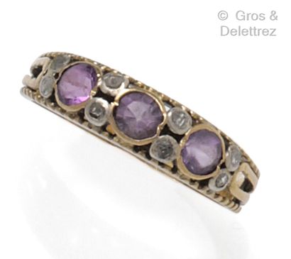 null Yellow gold and silver openwork wedding ring set with faceted oval amethysts...