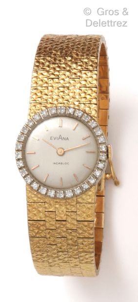 EVIANA Bracelet-montre de dame en or jaune, boîtier rond entouré de diamants taillés...