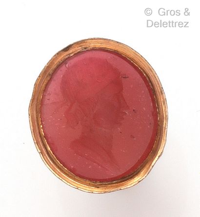 null A gilt metal "Cachet" pendant, decorated with an intaglio on carnelian. Length...