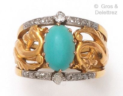 A yellow and white gold ring with a chimera,...