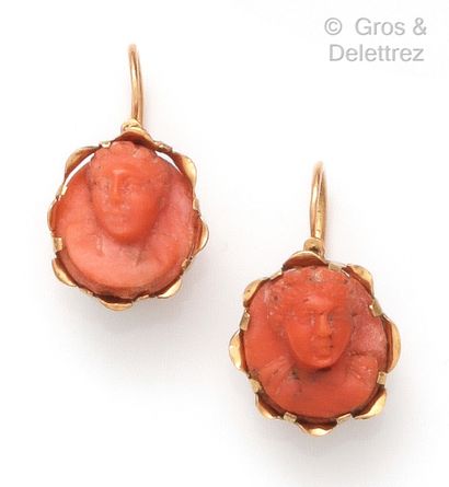 null Pair of yellow gold earrings, decorated with cameos on coral representing characters....
