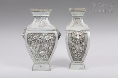 null Pair of pewter rectangular vases decorated with poppy flowers and jungle scenes...