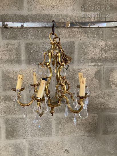null A Rococo style ormolu chandelier with six acanthus scroll lights, finished with...
