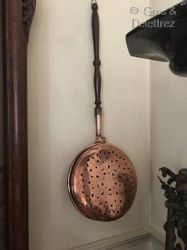null Set of three brass and copper heaters with turned wooden handles.

18th and...