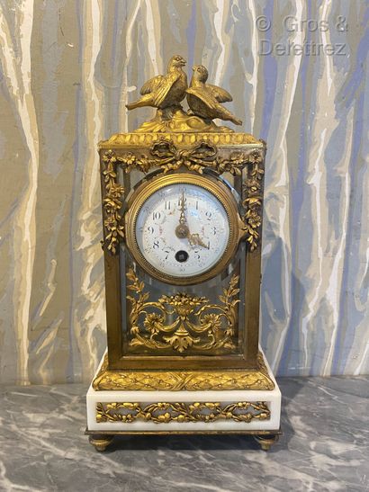 null Rectangular gilt bronze clock forming falls of flowers and ribboned garlands...