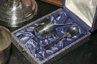 null A silver plated lot comprising : 

- a pair of torches with palmettes decoration,...