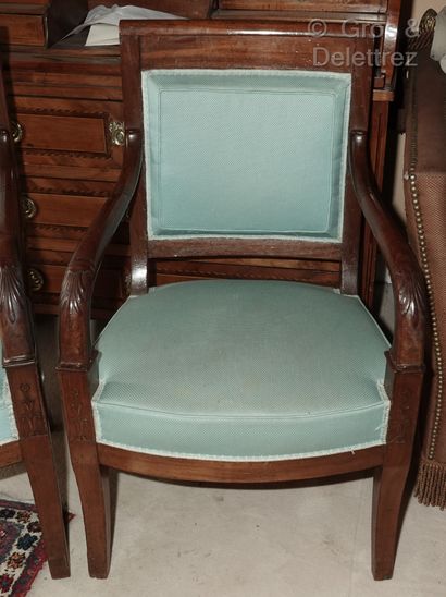 null A pair of mahogany and mahogany veneered armchairs, the arms ending in palmettes,...