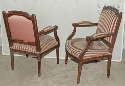 null Pair of armchairs in moulded and carved natural wood, the flat backs in the...