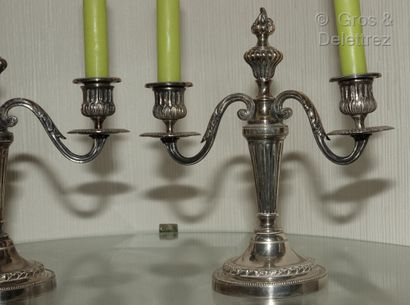 null A pair of small silver plated two-light candelabras decorated with flutes, acanthus...